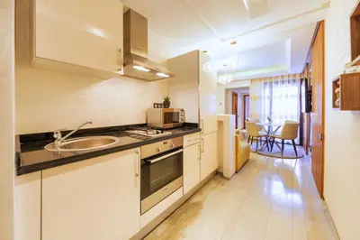 a kitchen with a sink and a counter top at Menara garden in Marrakech