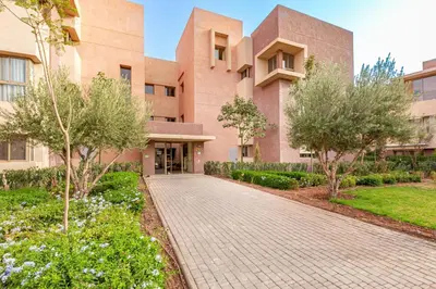 a building with a brick walkway in front of it at New! Résidence de Luxe avec Piscine & parking in Marrakech
