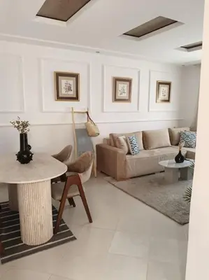 a living room with a couch and a table at Family House Marrakech in Marrakech