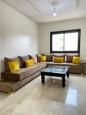 a living room with a couch and a coffee table at Condo in Marrakech in Marrakech