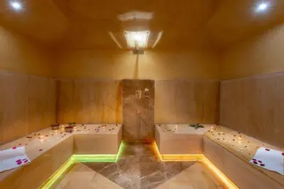 a room with two beds and two tubs at Villa des stars in Marrakech