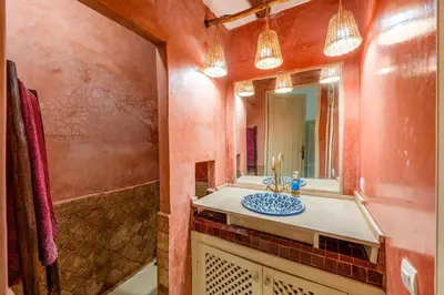 a bathroom with a sink and a mirror at Dar Karole-Privé-petits déjeuners inclus in Marrakech