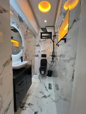 a bathroom with a sink and a mirror at Appartement 1 chambre in Marrakech