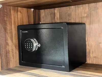 a small black television sitting on a wooden shelf at Appartement chic Gueliz kasbel 211 in Marrakech