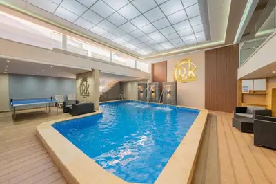 a large swimming pool in a hotel lobby at Appartement chic Gueliz kasbel 211 in Marrakech
