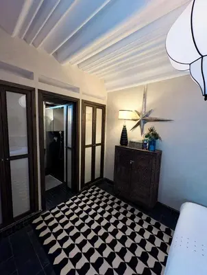 a room with a black and white checkered floor at Riad Lulua Exclusif 3 Chambres et Piscine Rooftop in Marrakech