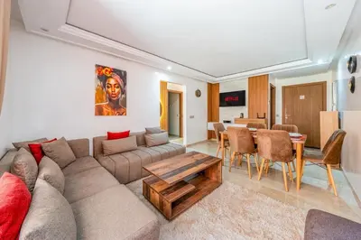 a living room with a couch and a table at Appartement de prestige Gueliz kasbel 212 in Marrakech