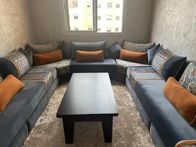 a living room with couches and a coffee table at Liton's Avenue in Marrakech