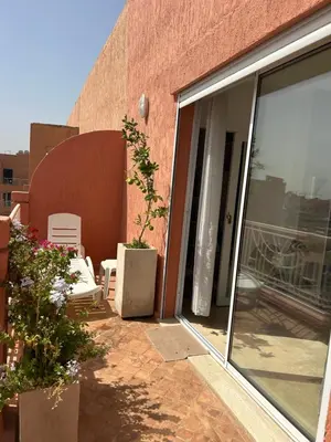a patio with sliding glass doors on a building at Appartement 3 chambres Gueliz Hivernage Marrakech centre 5 Etage M21 in Marrakech