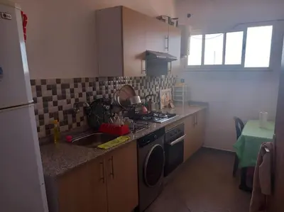 a kitchen with a sink and a stove top oven at Appartement Chic à Marrakech in Marrakech