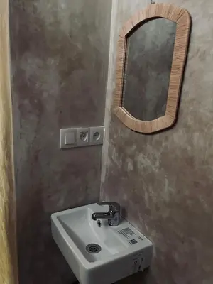 a bathroom with a sink and a mirror at DAR SI AHMED Riad Typique avec Terrasse Panoramique et Vue Exceptionnelle in Marrakech