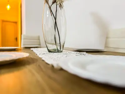 a vase with flowers in it sitting on a table at L'Havre de Paix - Proxi Centre - 2 Chambres in Marrakech