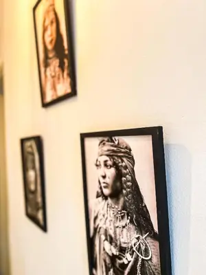 a picture of a woman on a wall with pictures at L'Havre de Paix - Proxi Centre - 2 Chambres in Marrakech
