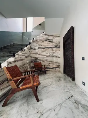 a room with a bench and a wall with a mural at Dream villa in Marrakech