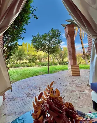 a pile of food sitting on top of a patio at Palmeraie vue piscine 3 in Marrakech