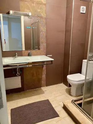 a bathroom with a sink and a toilet at Apparemment 1 chambre salon à coté de la gare guéliz 16 in Marrakech