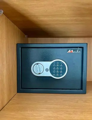 a television with a remote control in a cabinet at Appartement 2 chambres salon à coté de carré éden Perles3 in Marrakech