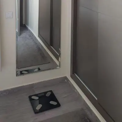 a mirror and a mat on the floor in a room at Apartment in Marrakech - WiFI - IPTV Movies - equipped - free parking in Marrakech