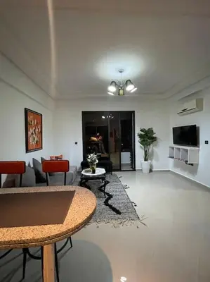 a living room with a couch and a table at Superbe studio en plein centre in Marrakech