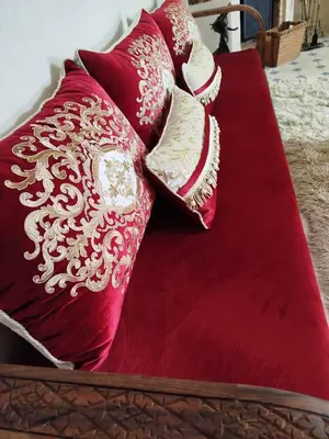 a pile of pillows sitting on a bed at Riad Les Trois Mages in Marrakech