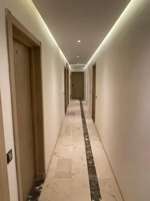 a corridor of a building with a long hallway at Appartement à louer Marrakech in Marrakech