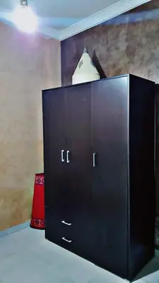 a black cabinet with a hanger on top of it at Cozy Bedroom Sidi maarouf in Marrakech