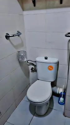 a bathroom with a white toilet in a room at Cozy Bedroom Sidi maarouf in Marrakech