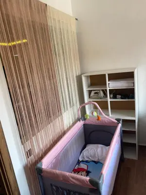 a childs bed in a room with a crib at Nour 5 in Marrakech