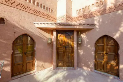 two doors on the side of a building at Villa Riad luxe centre marrakech majorelle Rue Yves st laurent in Marrakech