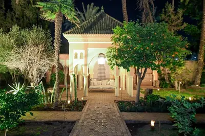 a gazebo in the middle of a garden at night at Villa Riad luxe centre marrakech majorelle Rue Yves st laurent in Marrakech