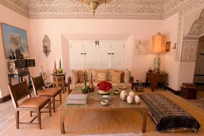 a living room with a couch and a table at Villa Riad luxe centre marrakech majorelle Rue Yves st laurent in Marrakech
