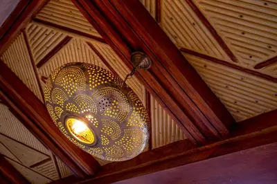 a chandelier hanging from the ceiling of a room at Riad Brothers in Marrakech