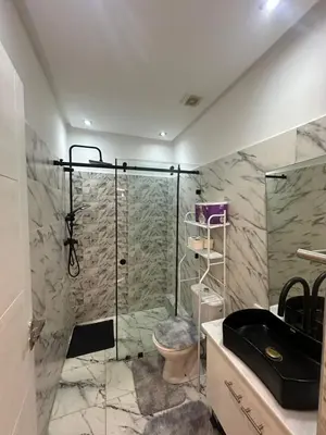 a bathroom with a shower and a sink at Centre ville T3 jacuzzi privé 2 min de la gare in Marrakech