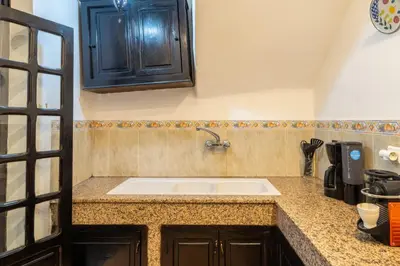 a kitchen with a sink and a counter top at Riad Sharqi Luminous A Sunny in Marrakech Old Town in Marrakech