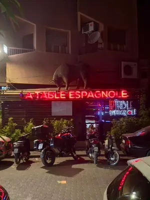 a group of motorcycles parked in front of a building at Charmant Appartement à Gueliz - À Deux Pas des Attractions Locales in Marrakech