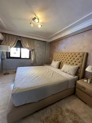 a bedroom with a large bed and a window at Luxury Duplex for Rent Suites,terrace,Swimimg Pool in Marrakech