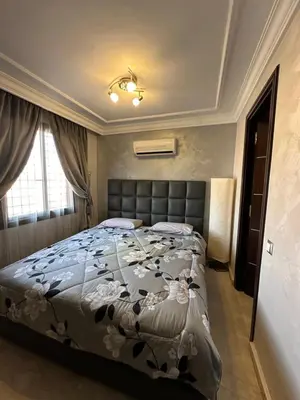 a bedroom with a large bed in a room at Luxury Duplex for Rent Suites,terrace,Swimimg Pool in Marrakech