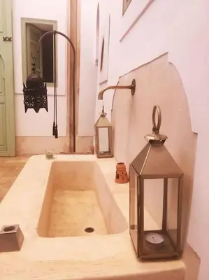 a kitchen with a sink with two lanterns on it at Dar Ibo- Entire House- in Marrakech
