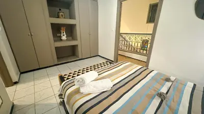 a bedroom with a bed with towels on it at Riad Beldi Chic Un Séjour Authentique Proche Médina in Marrakech