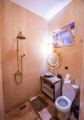 a bathroom with a toilet and a sink and a shower at Riad Bab Taghzout Marrakech in Marrakech