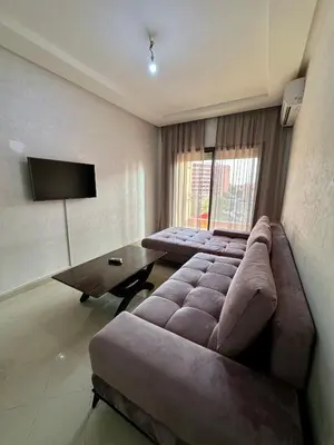 a living room with a couch and a table at Chambre salon à avenue med 6 centre de gueliz 10 in Marrakech