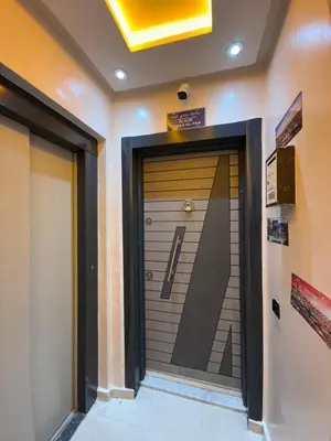 a door in a building with a sign above it at KSYI IMMO 2 Marrakech Aéroport in Marrakech