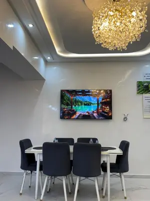 a conference room with a table and chairs at KSYI IMMO 2 Marrakech Aéroport in Marrakech