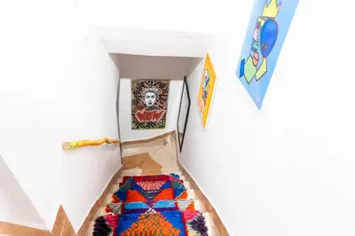 a hallway with a carpet on the floor in a room at Riad Sala Art Marrakech in Marrakech