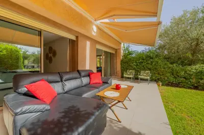 a living room with a couch and a table at Luxury XL Appart Golf View Retreat Private Garden in Marrakech