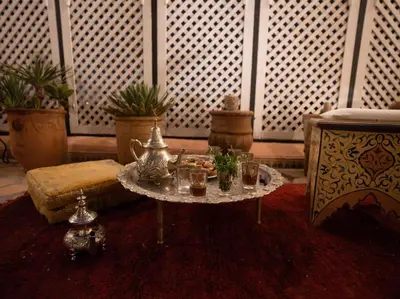 a living room with a table with glasses on it at Authentic house in the old Medina of Marrakech in Marrakech