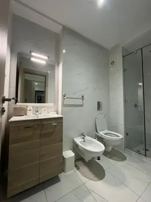a bathroom with a sink and a toilet and a shower at Appartement avec piscine in Marrakech