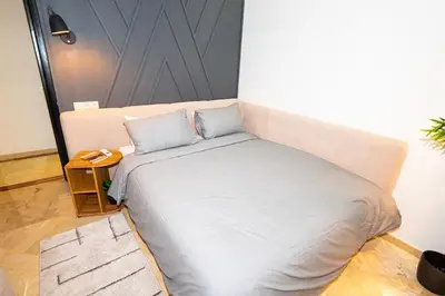 a bed with two pillows on it in a room at Marrakech Reverie Downtown in Marrakech