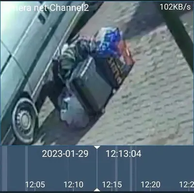 a man with a suitcase on the side of a car at Dar ALBIDAWI in Marrakech
