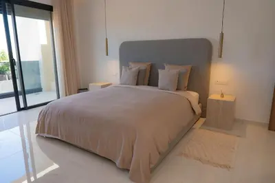 a bedroom with a large bed and a large window at Villa Volubilis - Marrakech in Marrakech
